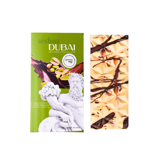 Two chocolate bars, one green with a statue design and the other with a decorative pattern, on a white background.