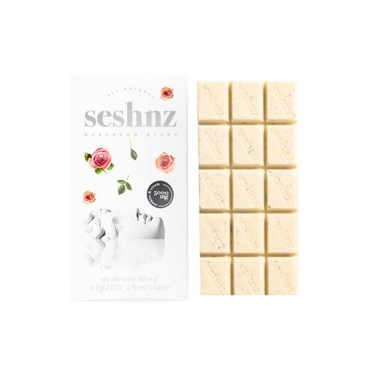 Seshnz organic cookies and cream chocolate bar packaging with white chocolate bars on a white background